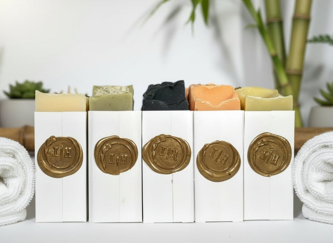 Five bars of soap sideways displaying the IH crest in gold wax seal.